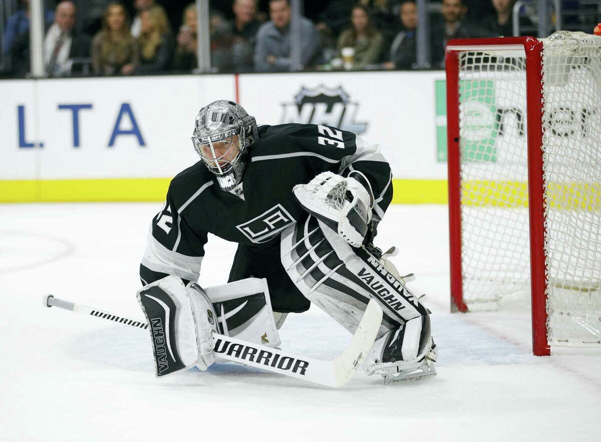 Los Angeles Kings goalie Jonathan Quick kneels in front of the net during the third period of an NHL hockey game against the Philadelphia Flyers, Saturday, Jan. 2, 2016, in Los Angeles. (AP Photo/Jae C. Hong)