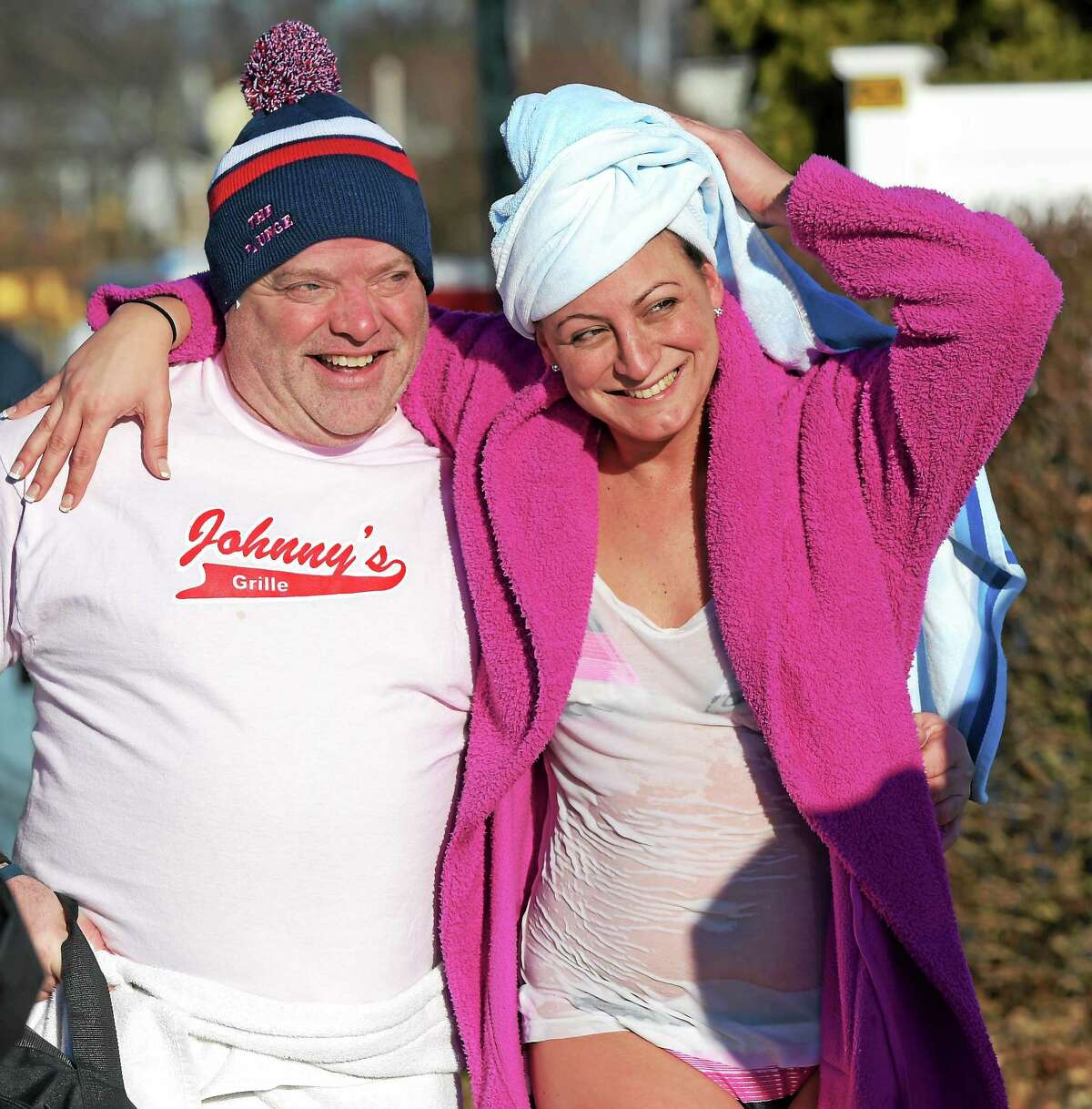 Michael Richetelli and friend Dana Fiamini, both of West Haven enjoy each other’s company after they ran into the frigid Long Island Sound at West Haven’s 15th Annual Icy Plunge for the Cure, a fundraiser which benefits breast cancer research, at the Savin Rock Conference Center in West Haven Saturday morning, January 16, 2015.