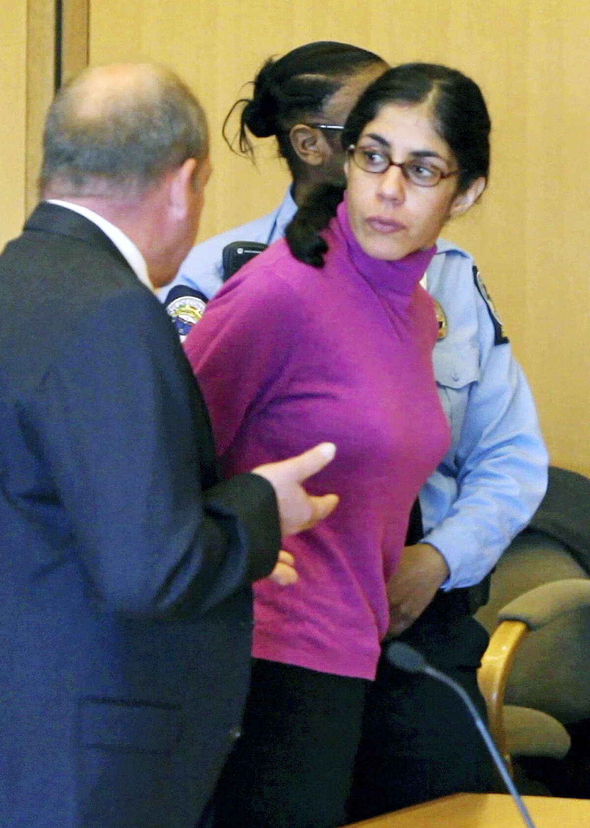 In this April 27, 2012 file photo, Sheila Davalloo looks back in Superior Court in Stamford Conn., following her sentencing for the 2002 murder of Anna Lisa Raymundo. The Connecticut Supreme Court ruled Thursday, Dec. 31, 2015, against an appeal by Davallo, saying that a state law protecting married couple’s conversations as confidential does not apply to the convicted killer, who protested the use of self-incriminating comments she made to her husband as evidence against her at trial.