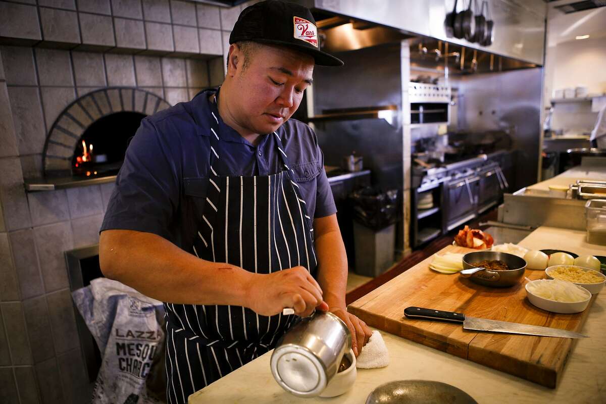 Chef Rob Lam of Butterfly Restaurant makes his version of French Onion Soup on Thursday, Dec. 12, 2013 in San Francisco, Calif.
