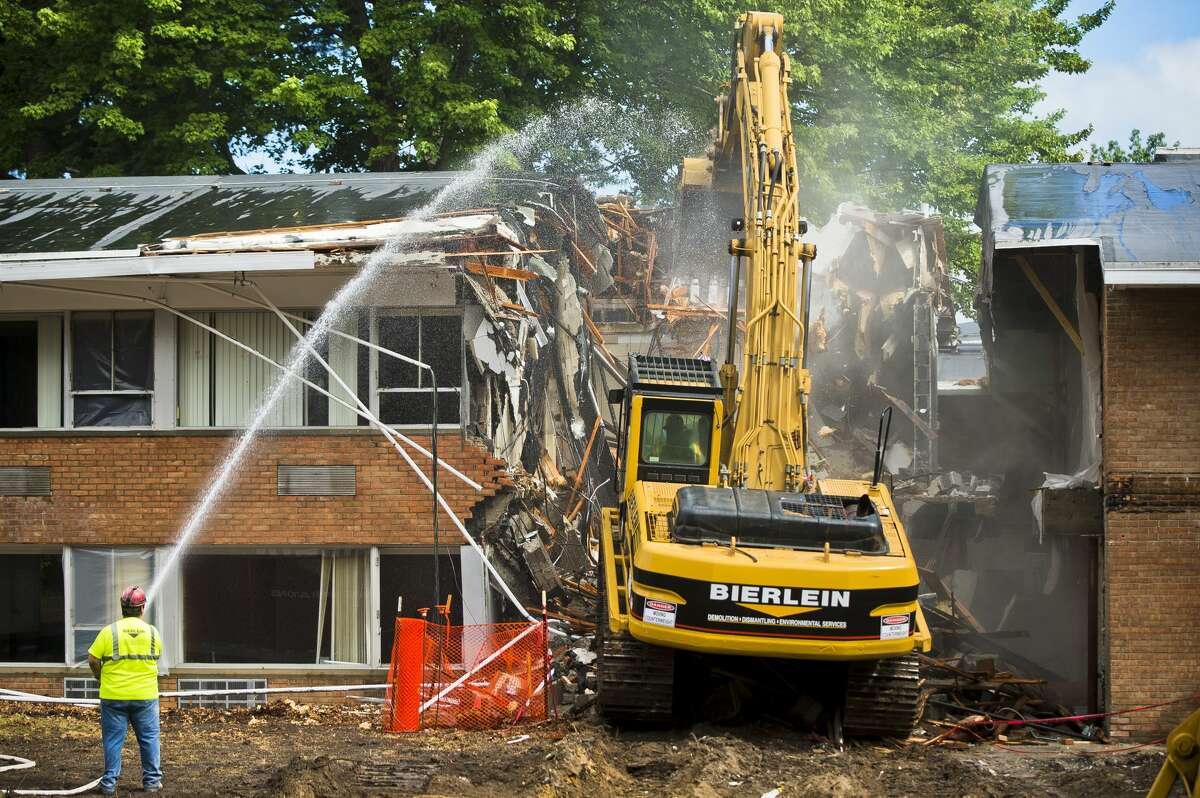 Demolition begins on MidMichigan Medical Center's Sugnet Building, also known as the original Midland Hospital, which will be replaced with a new Heart and Vascular Center, on Monday, July 24, 2017 in Midland.