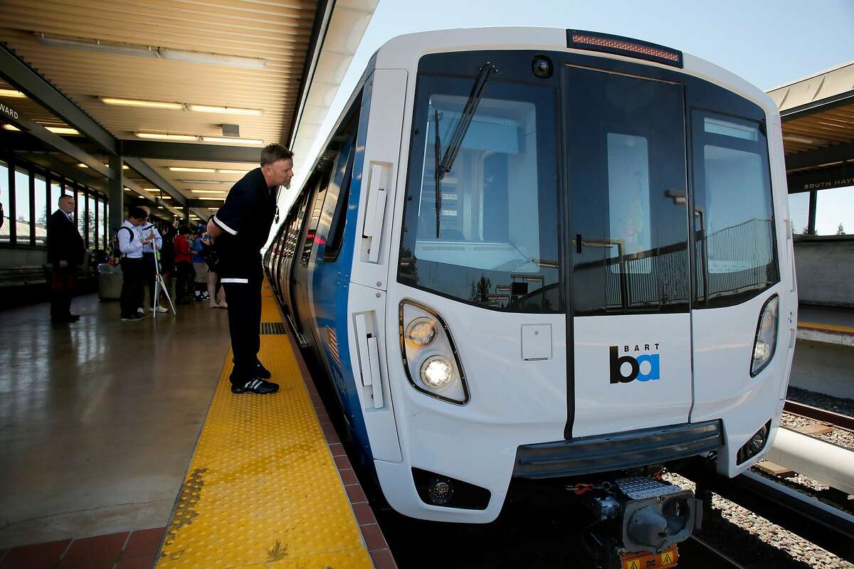 Kirk Paulsen, a 23-year train operator, peers inside a new BART car at the South Hayward Station in 2017.