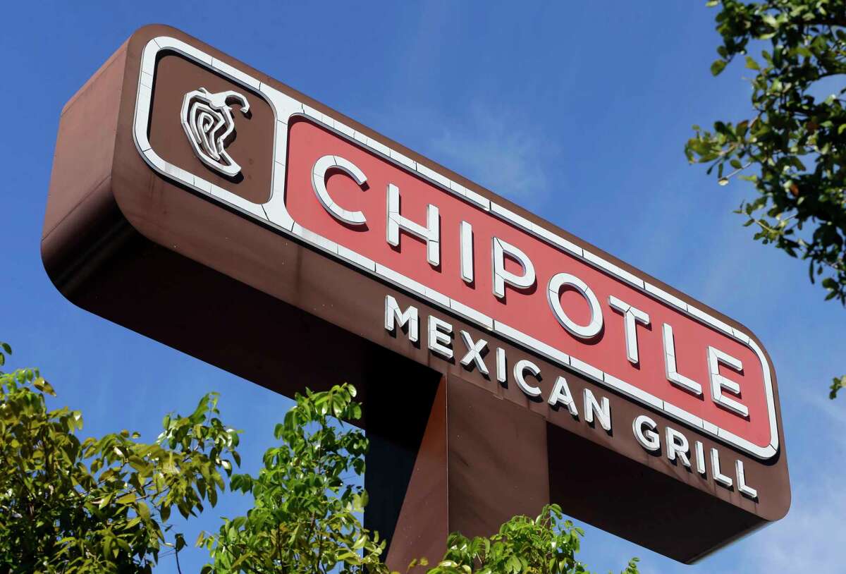 FILE - This Monday, Feb. 8, 2016, file photo shows the sign at a Chipotle restaurant. A state health official says a second person has tested positive for norovirus after eating at a Chipotle in Sterling, Va., before it was temporarily closed on Monday, July 17, 2017, following reports of illnesses. Chipotle reopened the suburban Washington, D.C., location Wednesday, July 19, after a "complete sanitization." (AP Photo/Alan Diaz, File)