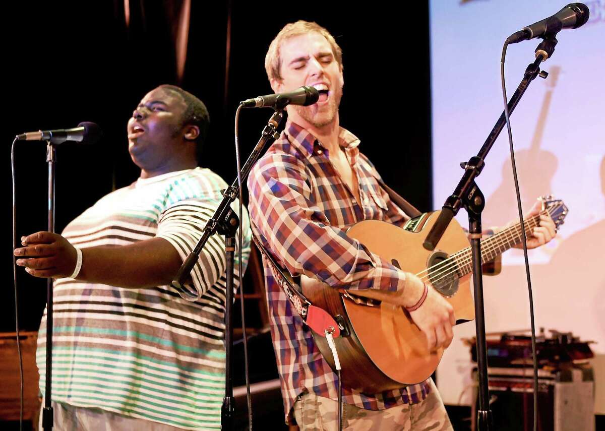 Singer, guitarist and pianist Jeremiah Brown of New Haven, 16, left, and singer, songwriter, guitarist and founder of Musical Intervention Adam Christoferson of Hamden, 31, rehearsal earlier this week at Lyric Hall, 827 Whalley Ave. in New Haven.