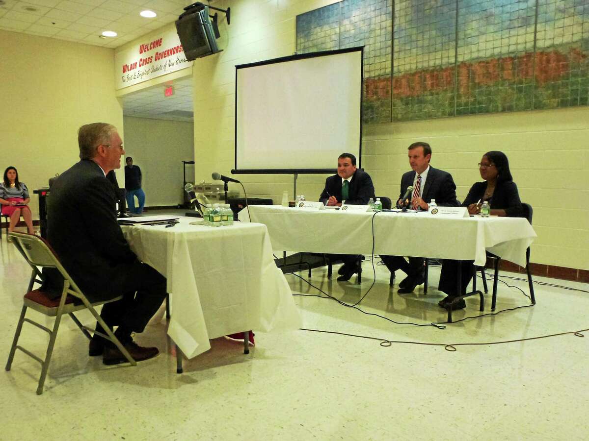U.S. Sen. Chris Murphy, DMHAS Commissioner Miriam E. Delphin-Rittman and Murphy staffer Joe Dunn take questions from the public during a public hearing Wednesday night in New Haven.