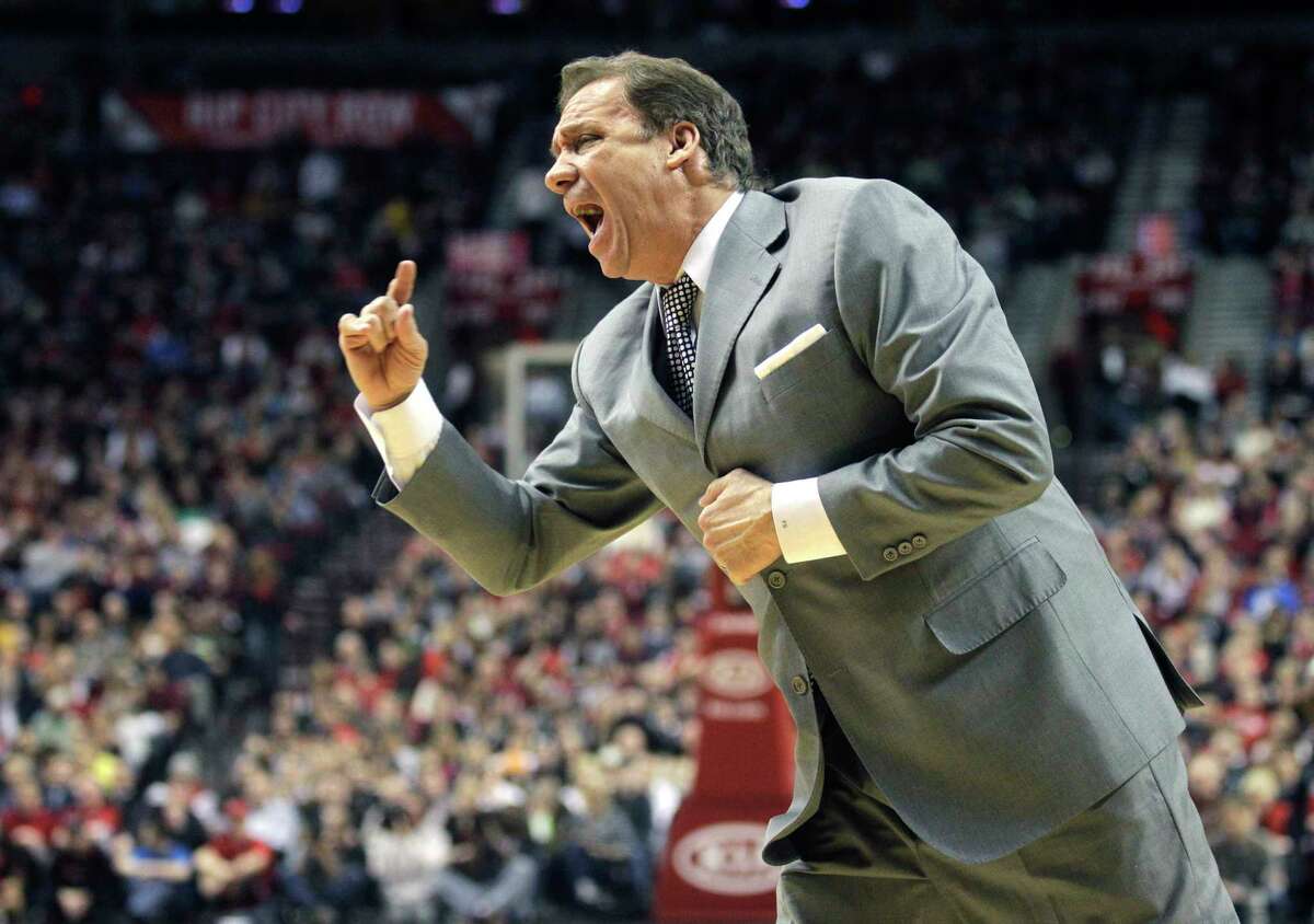 In this March 22, 2011 photo, Washington Wizards head coach Flip Saunders shouts at an official in the second quarter of an NBA basketball game against the Portland Trail Blazers in Portland, Ore.