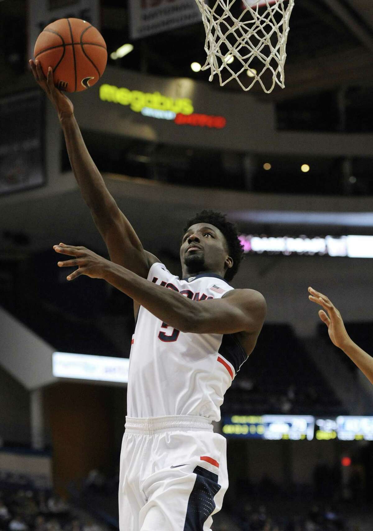 Connecticut's Daniel Hamilton goes up for a basket in the second half of an NCAA college basketball game against Central Connecticut State, Wednesday, Dec. 23, 2015, in Hartford, Conn. UConn won 99-52. (AP Photo/Jessica Hill)