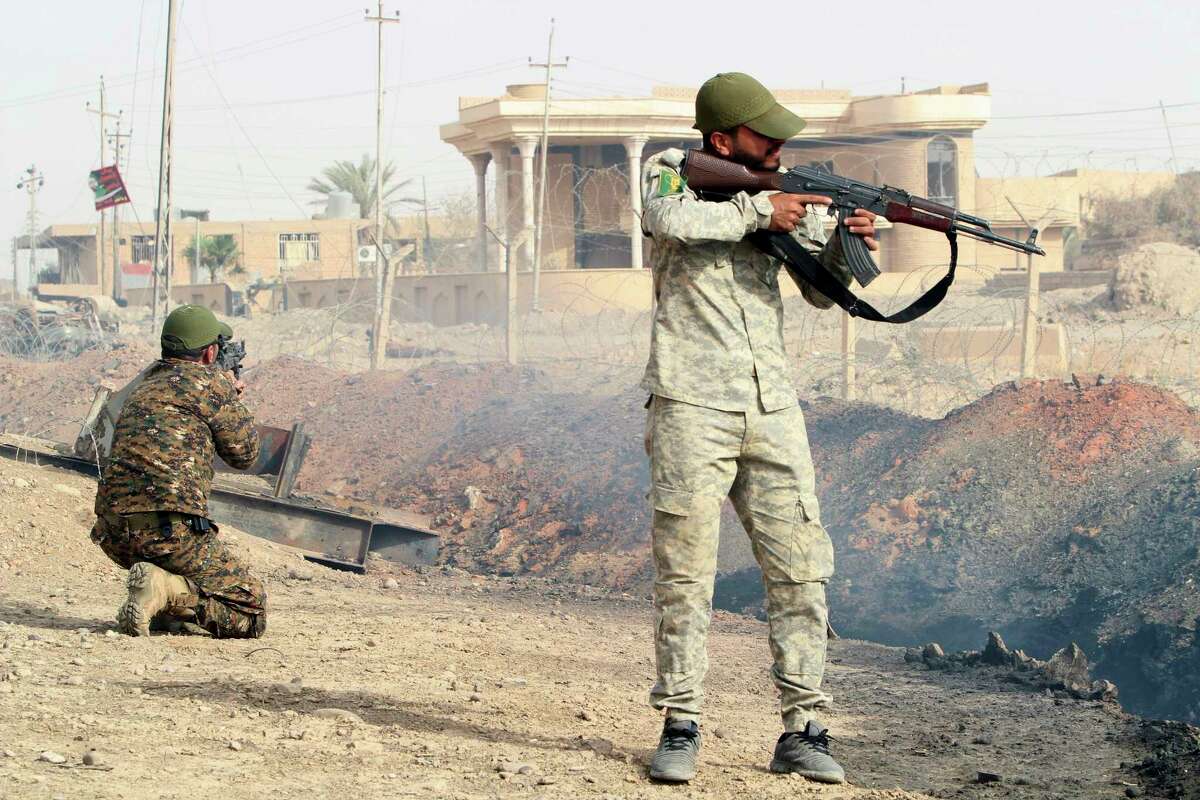 Iraqi security forces and allied Popular Mobilization Forces search Beiji oil refinery, some 250 kilometers (155 miles) north of Baghdad, Iraq, Thursday, Oct. 22, 2015. Coalition officials said that Iraqi security forces, backed by the paramilitary Popular Mobilization Forces and Iraqi federal police, and supported by airstrikes, continue to work to recapture and clear the western city of Ramadi and the city of Beiji, home to Iraq’s largest oil refinery.