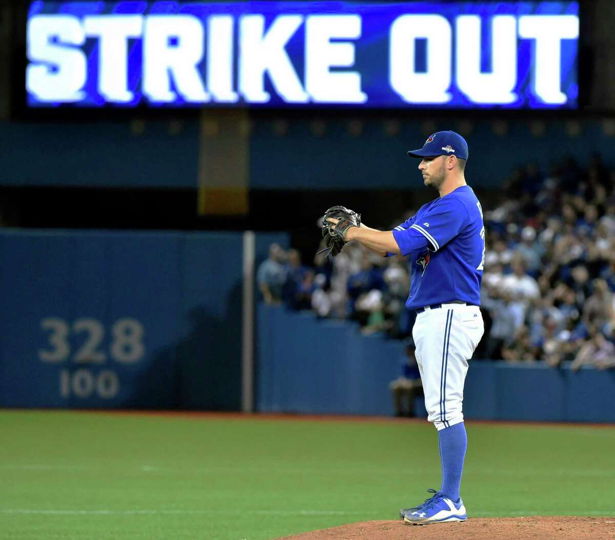 Toronto Blue Jays' starting pitcher Marco Estrada stands on the mound after striking out Kansas City Royals' Kendrys Morales during the eighth inning in Game 5 of baseball's American League Championship Series on Wednesday, Oct. 21, 2015, in Toronto. (Nathan Denette/The Canadian Press via AP) MANDATORY CREDIT