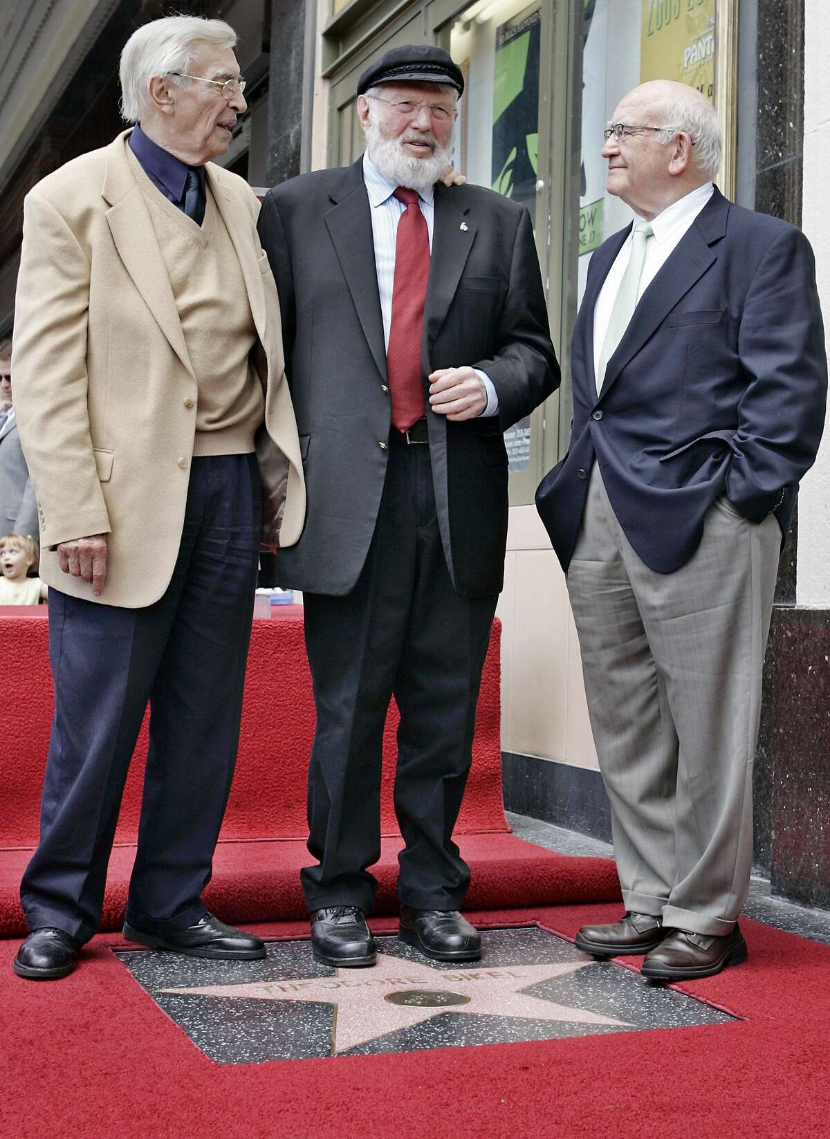 In this file photo, Theodore Bikel, center, with fellow actors Martin Landau, left, and Ed Asner, poses for photos during a dedication ceremony for Bikel’s star on the Hollywood Walk of Fame in Los Angeles. Bikel, the Tony- and Oscar-nominated actor and singer whose passions included folk music and political activism, died Tuesday morning of natural causes at UCLA Medical Center in Los Angeles, said his agent Robert Malcolm. He was 91.