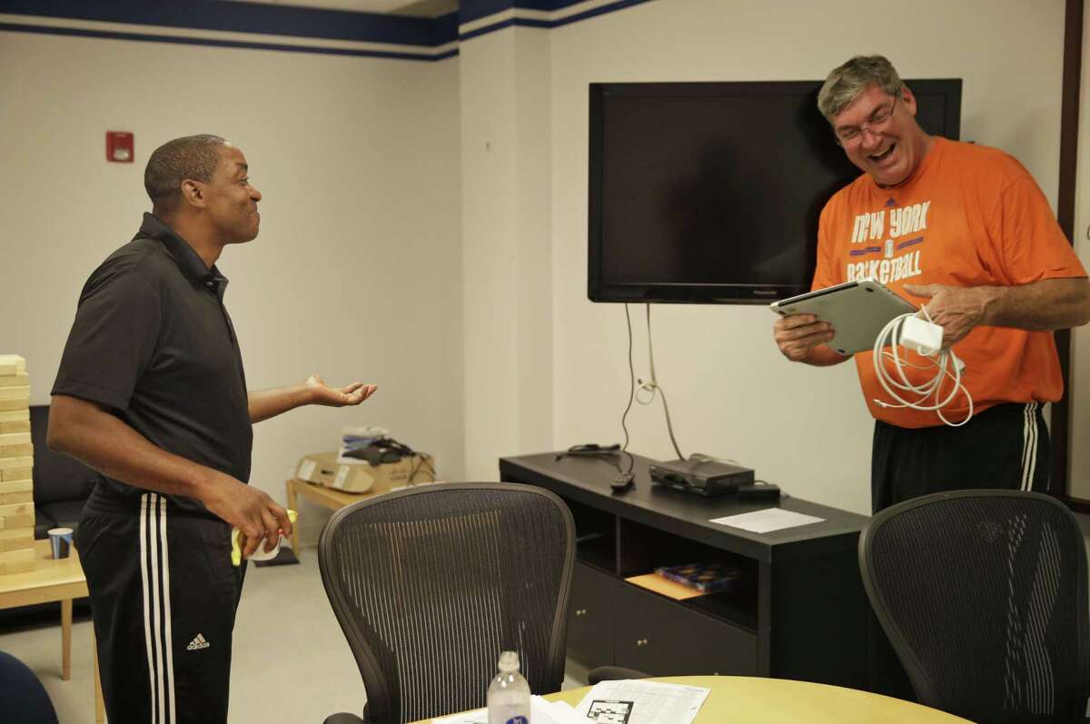 New York Liberty President Isiah Thomas, left, talks with head coach Bill Laimbeer after a coaches meeting.