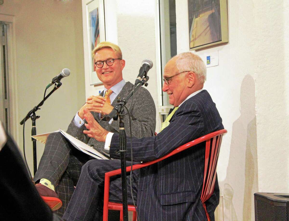Yale Deputy Chief Communications Officer Michael Morand, left, and Robert A.M. Stern, dean of the Yale School of Architecture, right, talk at Creative Arts Workshop on Dec. 10.