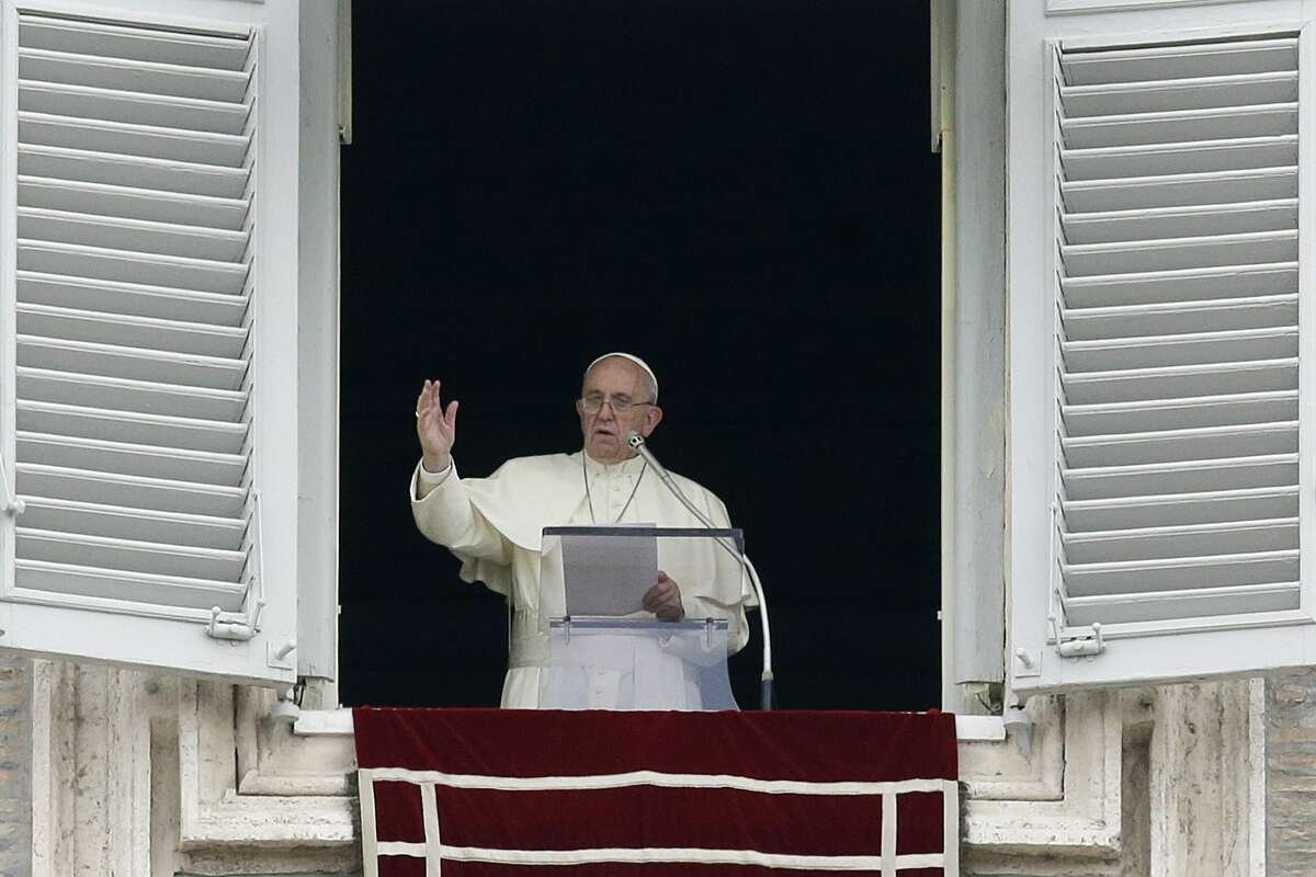 Pope Francis delivers a blessing from his studio’s window overlooking St. Peter’s Square on the occasion of the Angelus noon prayer at the Vatican on Sept. 13, 2015.