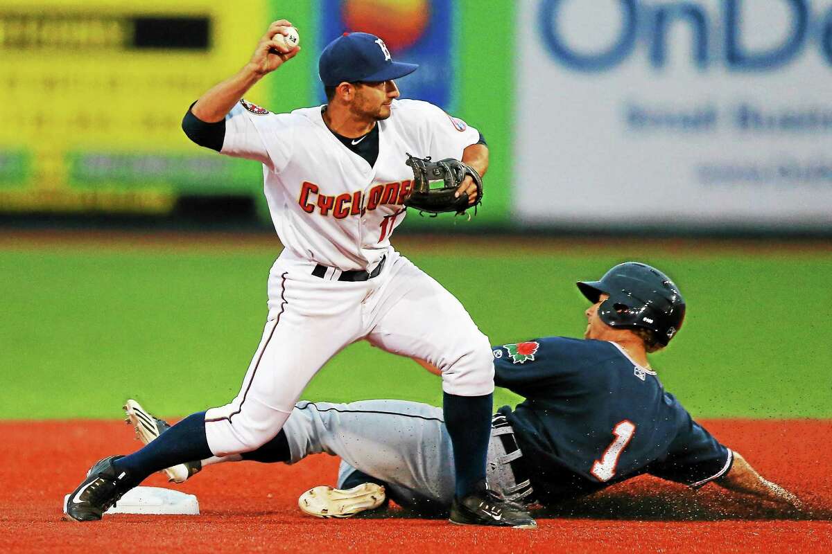 Brooklyn Cyclones second baseman Vinny Siena (11) throws to first as the Connecticut Tigers’ Brett Pirtle (1) slides into second during a June 25 game at MCU Park in Brooklyn.