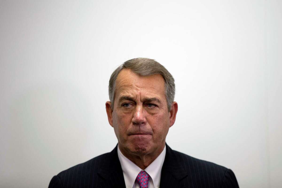 In this Oct. 7, 2015, photo, outgoing House Speaker John Boehner of Ohio listens as House Majority Leader Kevin McCarthy of Calif., speaks during a new conference on Capitol Hill in Washington. Boehner wants out. He really does. But the Ohio House Republican is staying put, for now _ and that could improve the chances for a debt limit increase by early next month to avoid a market-shattering government default and possibly a bipartisan budget deal to head off a government shutdown in December.