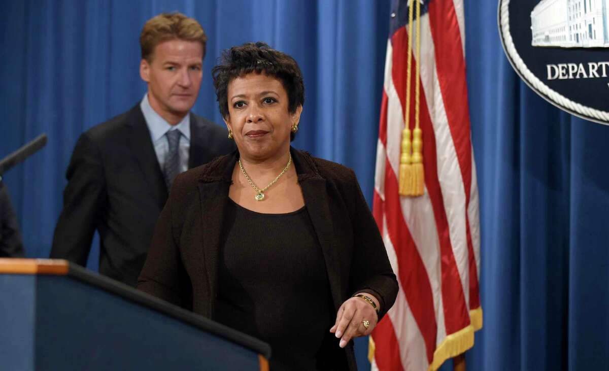 Attorney General Loretta Lynch, right, and U.S. Attorney in Chicago Zachary Fardon, left, arrive for a news conference at the Justice Department in Washington on Dec. 7, 2015. They spoke about an investigation into the patterns and practices of the Chicago Police Department after recent protests over a video showing a white Chicago police officer shooting a black teenager 16 times.