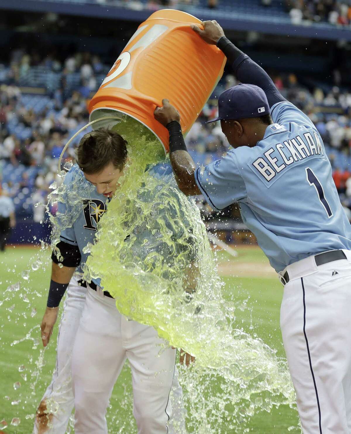 The Tampa Bay Rays’ Tim Beckham douses Richie Shaffer with Gatorade after the Rays defeated the New York Mets 4-3 on Sunday in St. Petersburg, Fla.