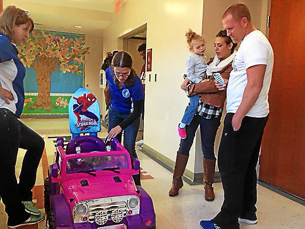 New Haven students retool cars for GoBabyGo