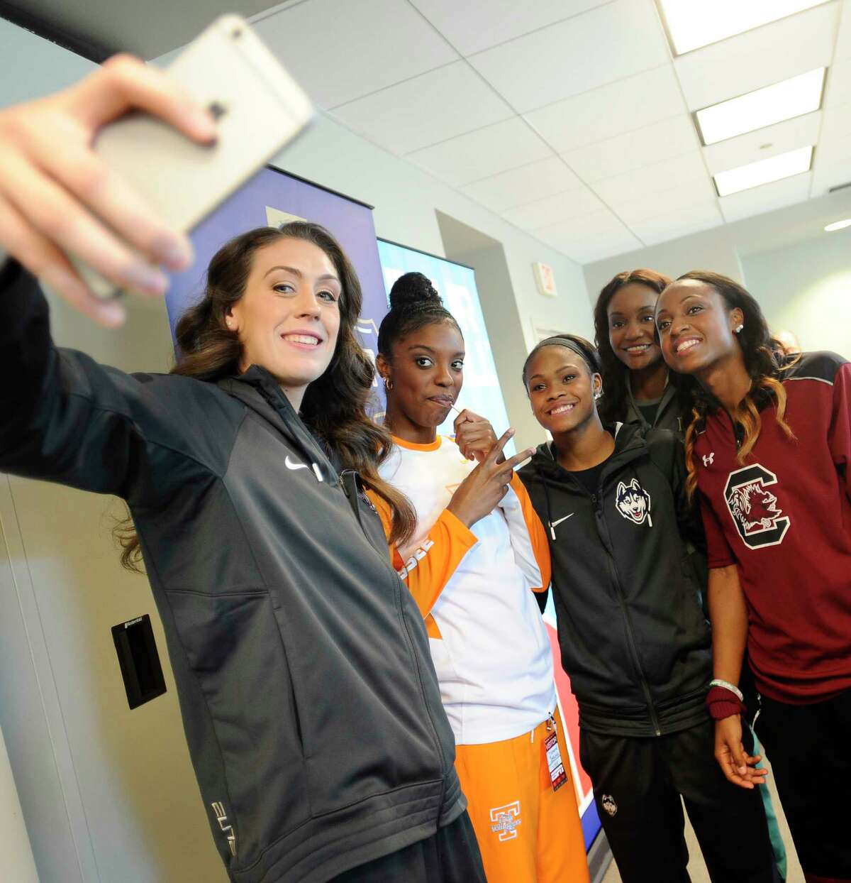 UConn’s Breanna Stewart, left, takes a photo with, from left, Tennessee’s Diamond DeShields, UConn’s Moriah Jefferson, Baylor’s Nina Davis and South Carolina’s Tiffany Mitchell during NCAA women’s basketball media day on Tuesday at ESPN in Bristol.