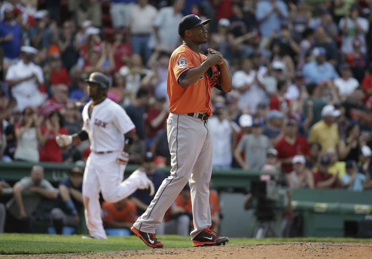 Boston Red Sox’s Hanley Ramirez runs the bases toward home after hitting a two-run home run off a pitch by Houston Astros relief pitcher Tony Sipp, right, in the seventh inning of a baseball game against the Houston Astros at Fenway Park, Sunday, July 5, 2015, in Boston. The Red Sox won 5-4. (AP Photo/Steven Senne)