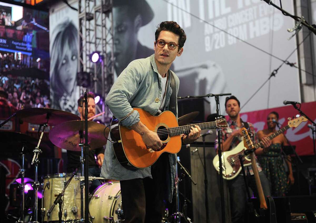 In this Sept. 26, 2014 photo, musician John Mayer performs at the Rock In Rio USA event in Times Square in New York.