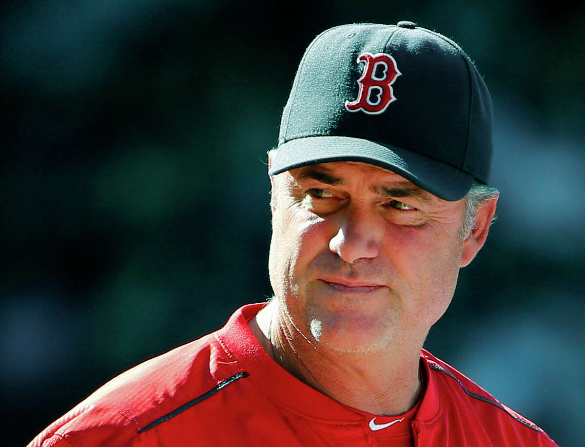 In this Aug. 2, 2015 photo, Boston Red Sox manager John Farrell watches action during the eighth inning of a baseball game against the Tampa Bay Rays at Fenway Park in Boston.