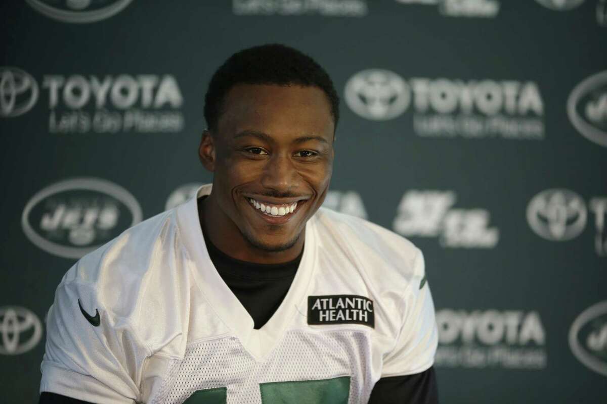 Wide receiver Brandon Marshall smiles during a press conference after an NFL training session at London Irish training ground Friday.