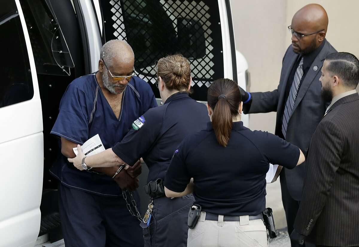 James Mathew Bradley Jr., 60, of Clearwater, Florida, left, arrives at the federal courthouse for a hearing, Monday, July 24, 2017, in San Antonio. Bradley was arrested in connection with the deaths of multiple people packed into a broiling tractor-trailer. (AP Photo/Eric Gay)