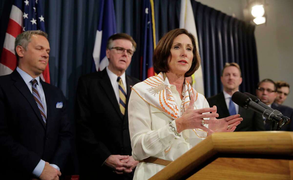 FILE - In this March 6, 2017, file photo, Texas Sen. Lois Kolkhorst, front, backed by Texas Lt. Gov. Dan Patrick, center, and other legislators talks to the media during a news conference to discuss Senate Bill 6 at the Texas Capitol in Austin, Texas. Just months after a high-profile study revealed that Texas has one of the highest maternal mortality rates in the developed world, state lawmakers failed to respond by passing comprehensive legislation to combat the crisis during the legislative session. (AP Photo/Eric Gay, File)