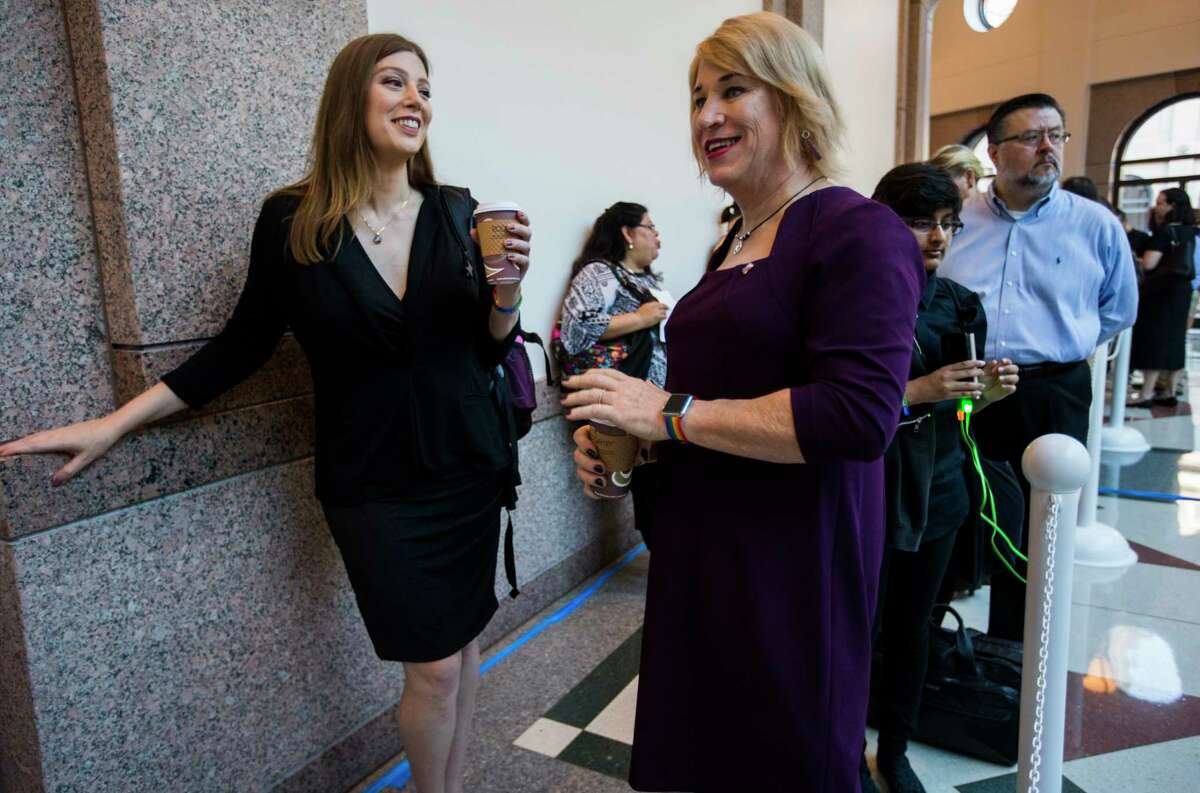 Ashley Smith, left, and New Hope Mayor Jess Herbst, who are both transgender women, stood at the front of the line to voice their opinions on the bathroom bill at a public hearing Friday at the state Capitol.