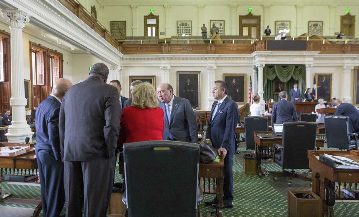 Senators gather around Finance Committee Chair Jane Nelson on Monday, the seventh day of a special session, at the Texas Capitol in Austin.