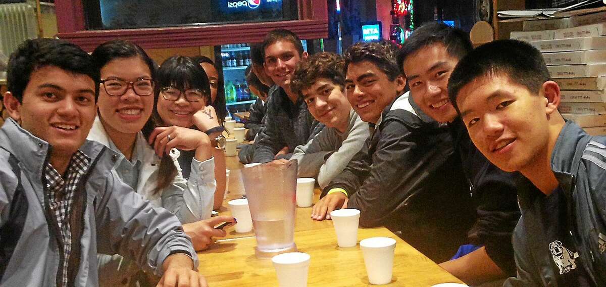Hacibey Catalbasoglu, fourth from right, visits Pizza at the Brick Oven with Yale students and incoming freshmen during Bulldog Days.