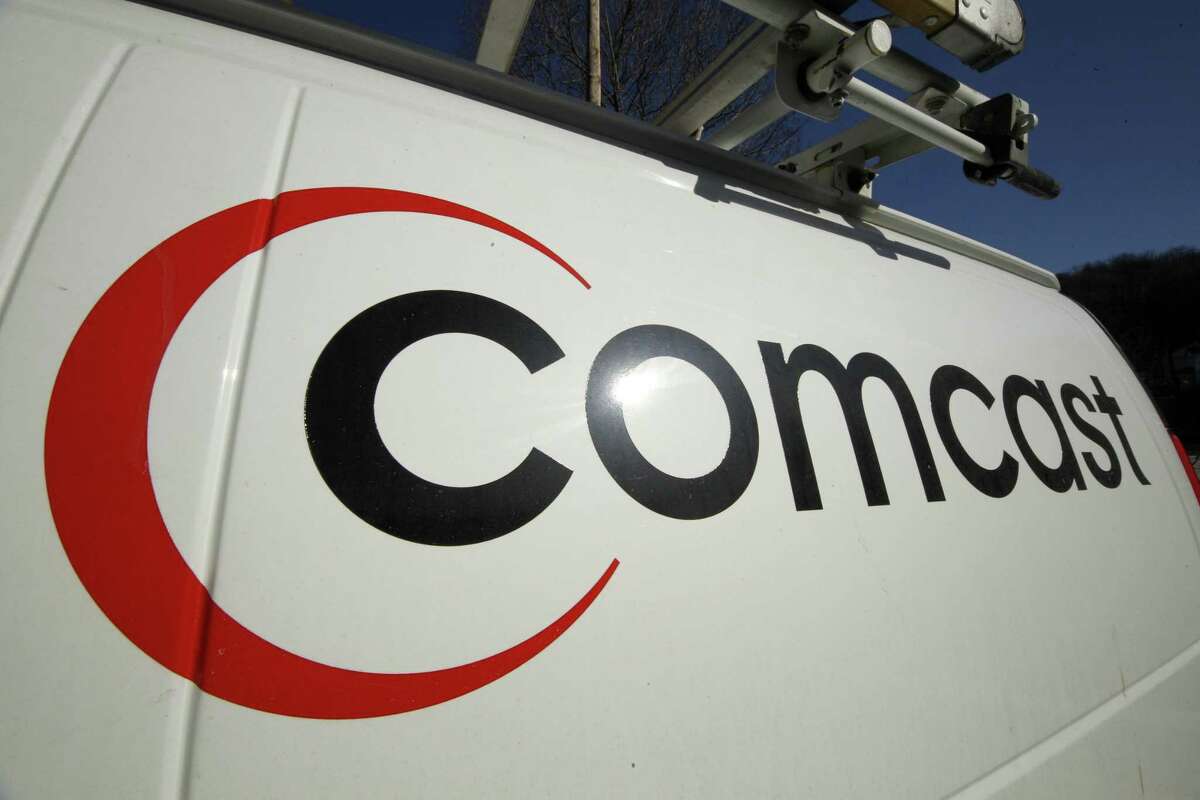 FILE - This Feb. 11, 2011 file photo shows the Comcast logo on one of the company's vehicles, in Pittsburgh. Wall Street appears increasingly convinced Comcast’s $45.2 billion purchase of Time Warner Cable is dead. telling indicator is the gap between the value Comcast’s all-stock bid assigned to each Time Warner Cable share and Time Warner Cable stock’s current price. That was at its widest point yet Thursday, April 23, 2015, a signal that investors are giving just 20 to 30 percent odds that the deal will go through, said Nomura analyst Adam Ilkowitz.