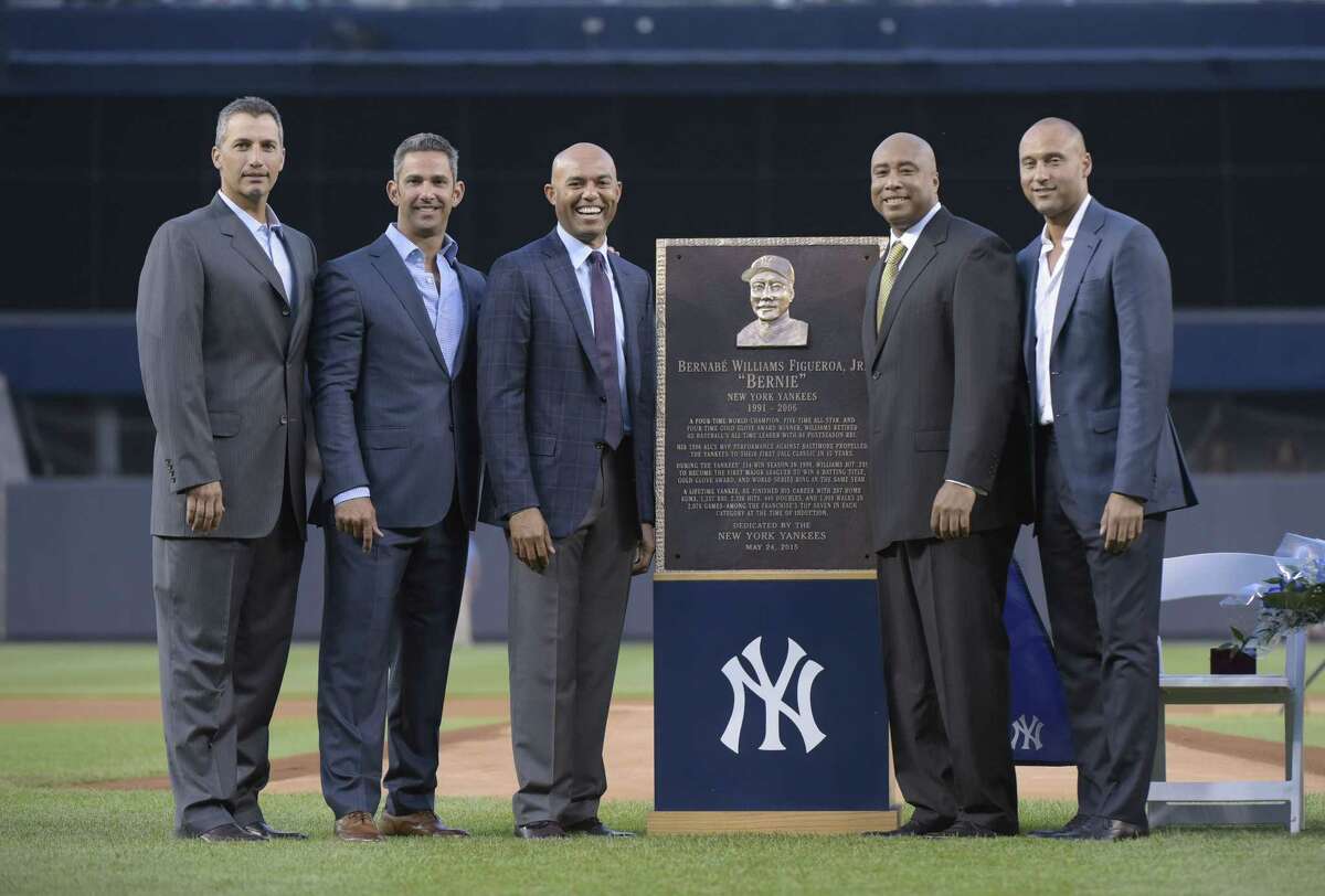 From left, New York Yankees’ Andy Pettitte, Jorge Posada, Mariano Rivera, Bernie Williams and Derek Jeter pose by Williams’ plaque before Sunday’s game at Yankee Stadium in New York.