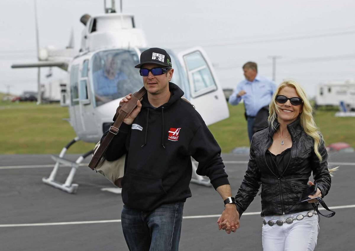 NASCAR suspended Kurt Busch, left, indefinitely after a judge said he almost surely choked and beat ex-girlfriend Patricia Driscoll.