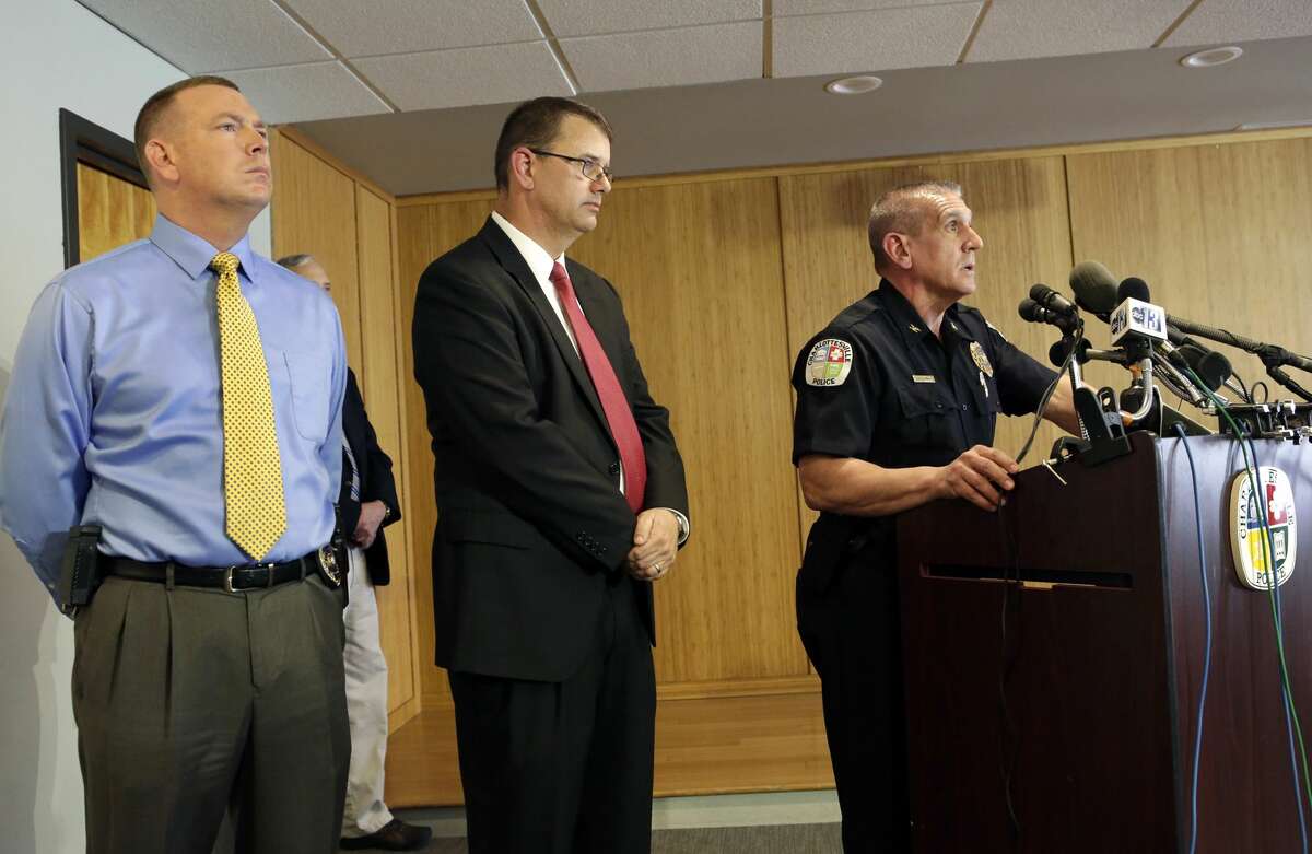 Charlottesville Police Chief Timothy Longo, right, speaks during a news conference as Detective Sgt. DJ Harris, center, and Detective Jake Via stand near Monday, March 23, 2015, in Charlottesville, Va. A five-month police investigation into an alleged gang rape at the University of Virginia that Rolling Stone magazine described in graphic detail produced no evidence of the attack and was stymied by the accuser’s unwillingness to cooperate, authorities said Monday.