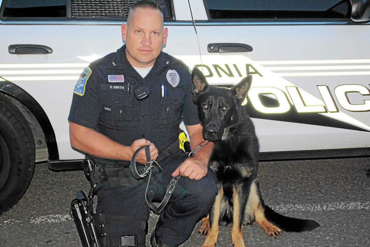 Officer Paul Smith and Kane, a K-9 who will start work with the Ansonia Police Department after completing three months of training.