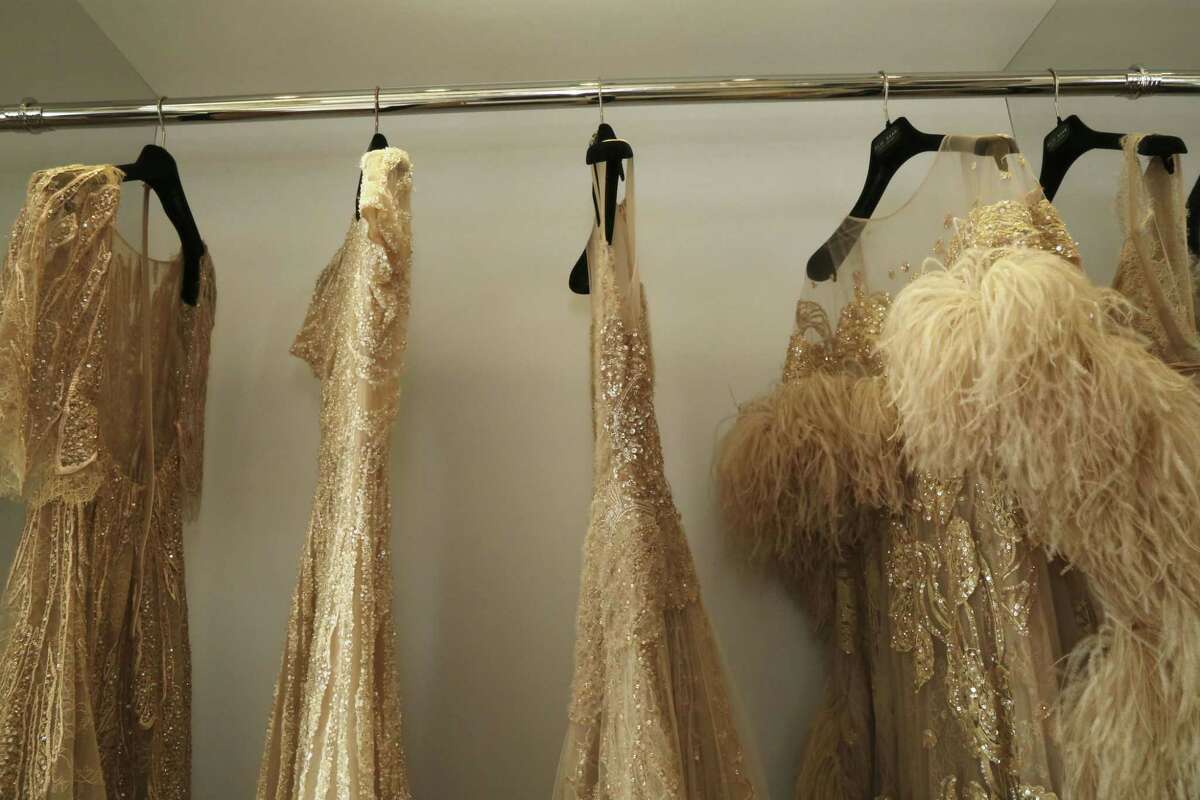 Dresses hang on a rack in room 331 of the Martinez Hotel, where Parisian fashion house Elie Saab provides sartorial services to celebrities attending the 68th international film festival, Cannes, southern France, Thursday, May 21, 2015. During the Cannes Film Festival, room 331 is radically transformed into a red carpet emergency room - where celebrities like Naomi Watts and Nicole Kidman can rush to if they pop out of a dress, or a zipper breaks minutes before their film premieres a stoneís throw away in the Cannesí Palais, the festivalís HQ. (Photo by Vianney Le Caer/Invision/AP)