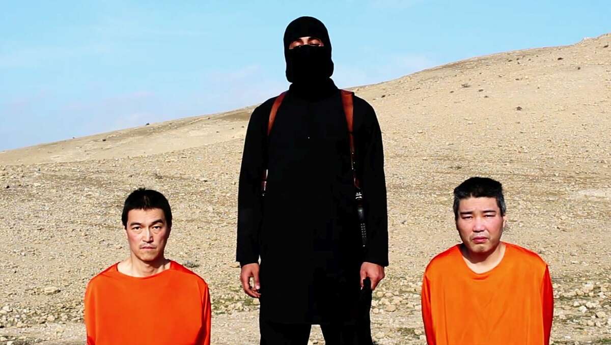 This image taken from an online video released by the Islamic State group’s al-Furqan media arm on Jan. 20, 2015, purports to show the group threatening to kill two Japanese hostages that the militants identify as Kenji†Goto Jogo, left, and Haruna Yukawa, right, unless a $200 million ransom is paid within 72 hours. Japan’s Foreign Ministry’s anti-terrorism section has seen the video and analysts are assessing it, a ministry official said on Tuesday.