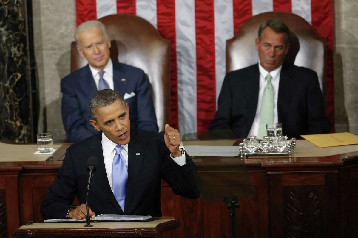 In this Jan. 28, 2014 photo, Vice President Joe Biden and House Speaker John Boehner of Ohio listens as President Barack Obama gives his State of the Union address on Capitol Hill in Washington.