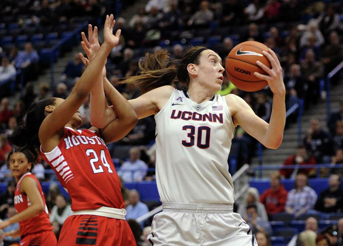 UConn’s Breanna Stewart (30) is fouled by Houston’s Mariah Mitchell (24) during the first half of Tuesday’s game.
