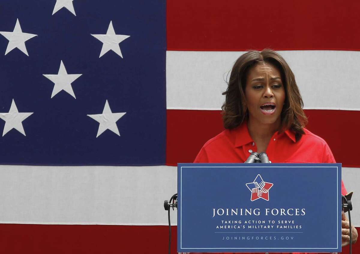 U.S. first lady Michelle Obama gives a speech as she arrives to meet with soldiers and their families at the U.S. Army Garrison Vicenza, northern Italy, Friday, June 19, 2015. Michelle Obama, who is visiting Italy on the second leg of a European trip, thanked the U.S. soldiers and their families for their service. (AP Photo/Antonio Calanni)