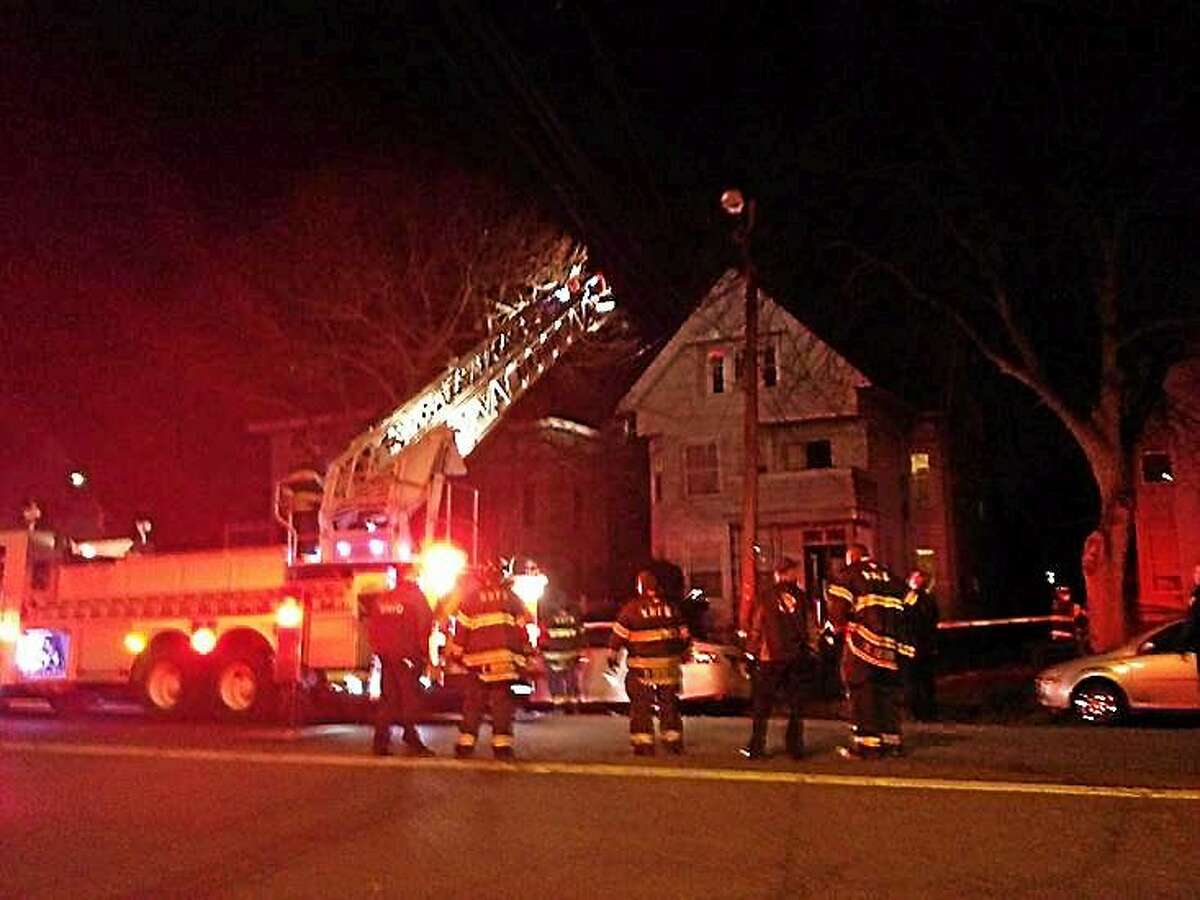 Emergency responders at the scene of a fire at 174 Blatchley Ave. in New Haven January 20, 2015.