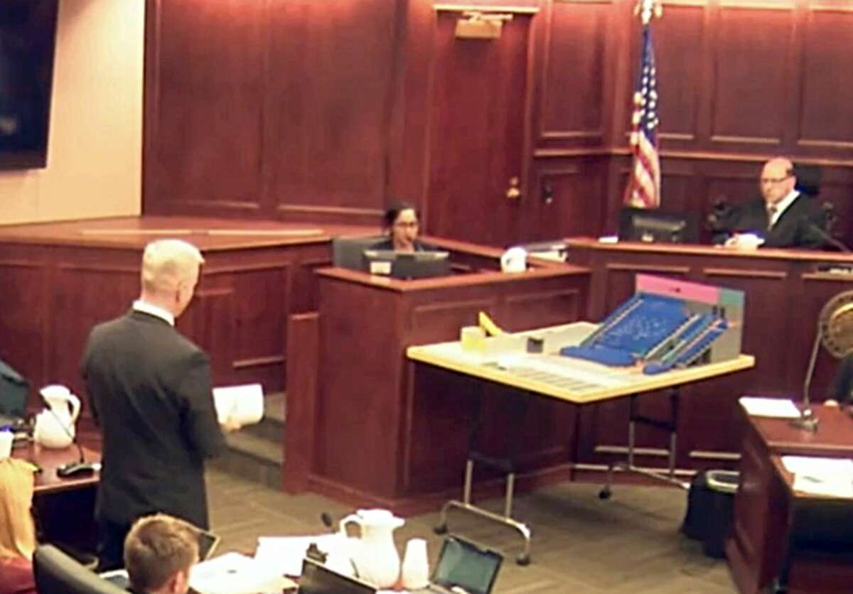 In this image made from a video, Gargi Datta, a former girlfriend of Colorado theater shooter James Holmes, is questioned by District Attorney George Brauchler , during a trail for Holmes, Wednesday, June 10, 2015, in Centennial, Colo. Datta said Wednesday that she met Holmes in 2011 and that they went to a horror film festival on their first date. Holmes pleaded not guilty by reason of insanity in the July 2012 shooting at a suburban Denver movie theater that killed 12 people and injured 70. (Colorado Judicial Department via AP, Pool)