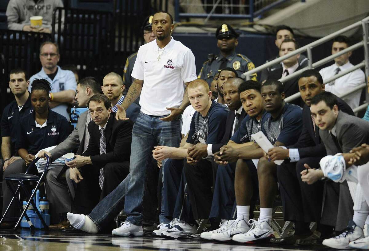 UConn’s Ryan Boatright watches play from the Connecticut bench in the first half of Wednesday’s NIT loss to Arizona State.