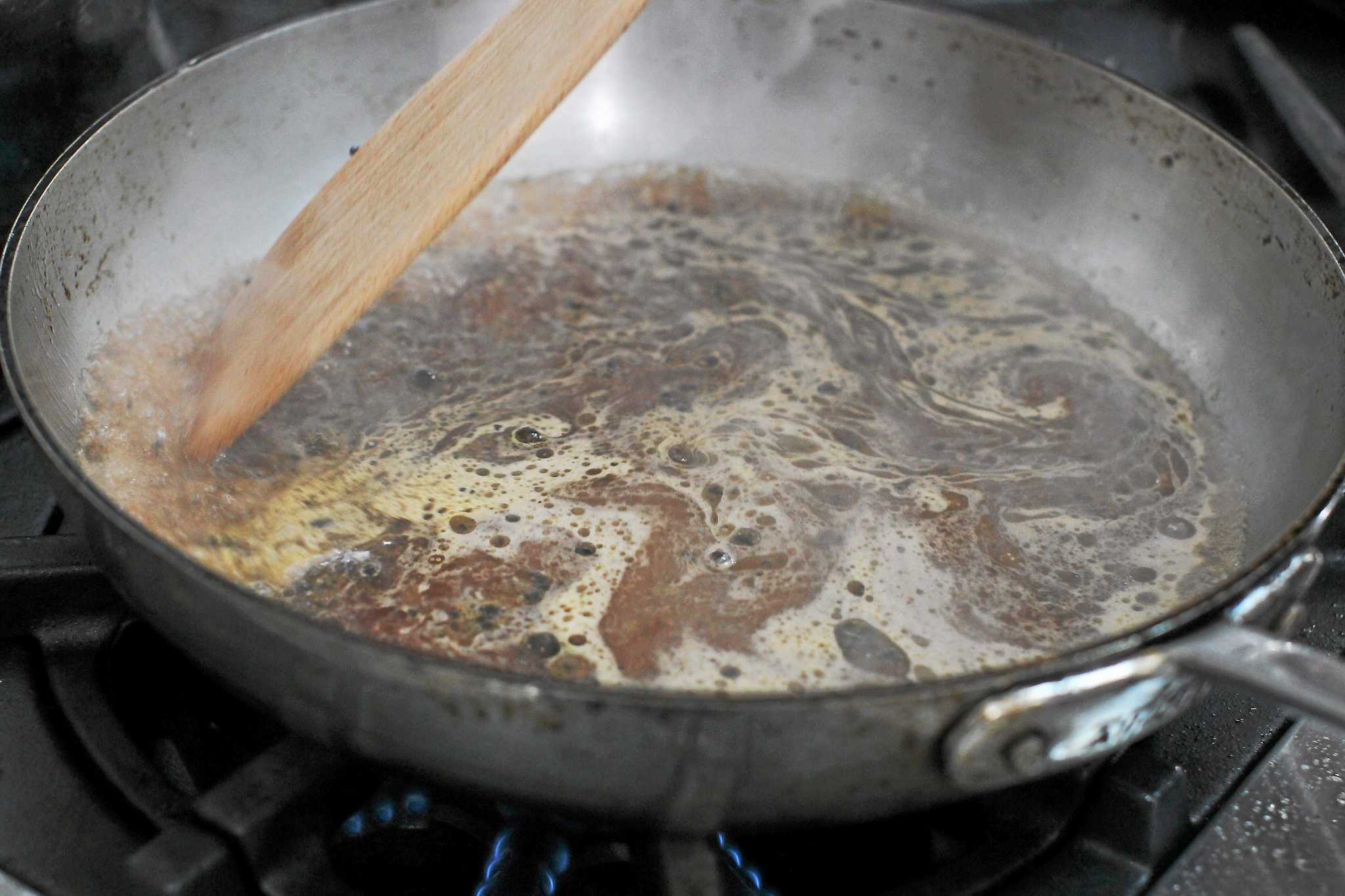 Mastering the art of deglazing a pan with steak au poivre