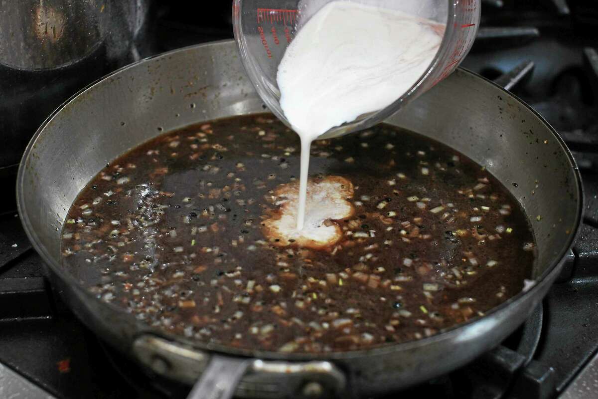 Mastering the art of deglazing a pan with steak au poivre