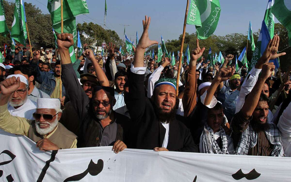 Supporters of the religious group Jamaat-e-Islami chant slogans during a demonstration against caricatures published in the French magazine Charlie Hebdo, in Karachi, Pakistan, Sunday, Jan. 18, 2015. (AP Photo/Fareed Khan)