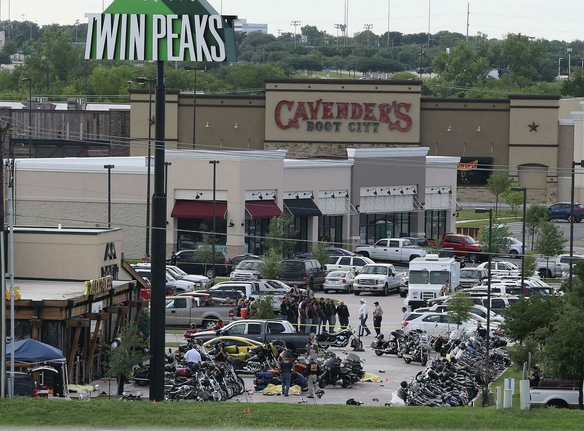 AP Photo/Jerry Larson Authorities investigate a shooting in the parking lot of the Twin Peaks restaurant on May 17, 2015, in Waco, Texas. Authorities say that the shootout victims were members of rival biker gangs that had gathered for a meeting.
