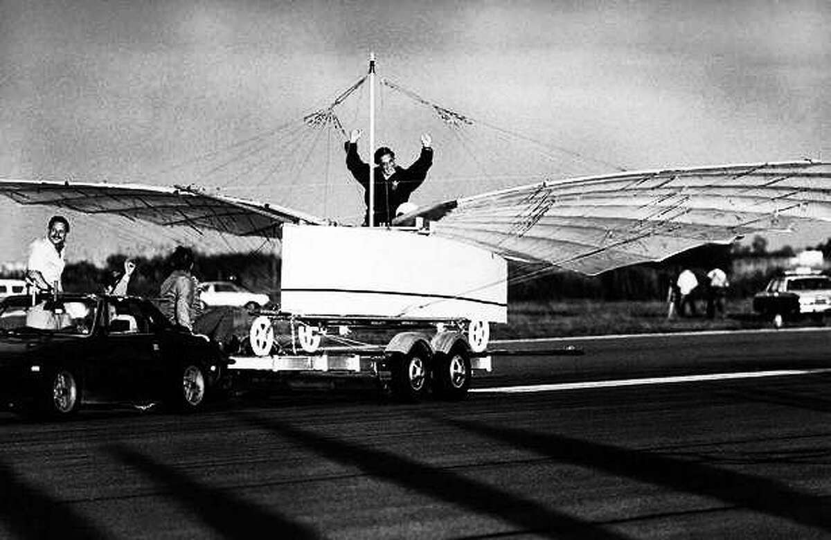 Actor Cliff Robertson signals success after he test-piloted a replica of an airplane challenging the Wright brothers' status as the first to fly on Friday morning, July 11, 1986 in a tethered test flight at Sikorsky Memorial Airport in Stratford, Conn. The aircraft, in the test flight, rose off the trailer while being towed. Its builders want to prove that Gustave Whitehead a Connecticut Aviation pioneer, flew in 1901. AP Photo